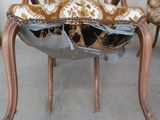 a chair that has been torn apart and is sitting on the floor