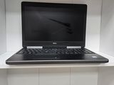 a laptop computer sitting on top of a white shelf