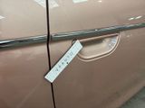 a sticker on the door of a car that says quality