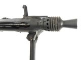 a machine gun that is sitting on a stand