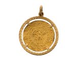 une pièce d'or à l'effigie d'une femme