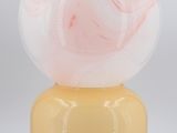 yellow and pink marble lamp with a white base on a white background