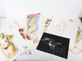 a picture of a bunch of drawings on a table