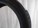 a close up of a tire on a white surface with a white background
