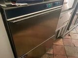 a kitchen with a stove and a dishwasher in it