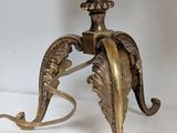 a lamp that is on a table with a flower on it
