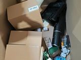a cardboard box filled with various items and a black umbrella