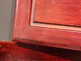 a cat that is sitting on top of a dresser