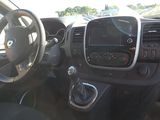 a dashboard of a small car with a steering wheel