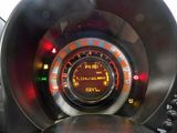 a close up of a car dashboard with a speedometer