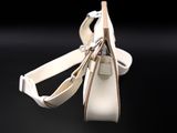 white leather handbag on a black background