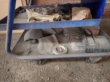 a blue cart with tools on it sitting on the floor