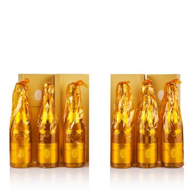 three bottles of gold colored liquid with a woman on them