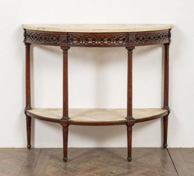 an image of a wooden table with a marble top on a parquet floor