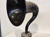 a black and silver gramphone on a white table
