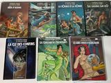 un grand nombre de livres posés sur une table