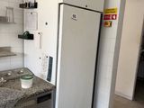 an image of a kitchen with a refrigerator and a sink