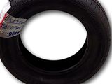 a close up of a tire on a white background with a sticker
