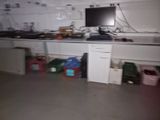an image of a kitchen with a lot of clutter on the counter