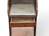 a small desk with a marble top and drawers