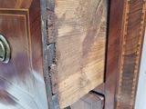 a piece of wood sticking out of the top of a dresser