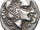 Gros plan sur une pièce de monnaie portant le visage d'un homme