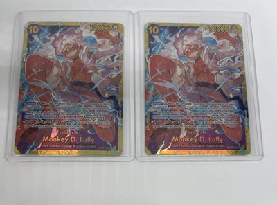 two pokemon trading cards in plastic cases on a white surface