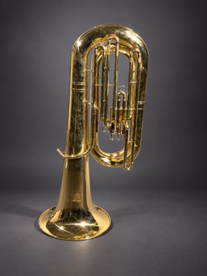 a brass trumpet on a black background