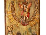 an old wooden plaque with a statue of an angel on it
