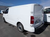 a white van that is parked in a parking lot