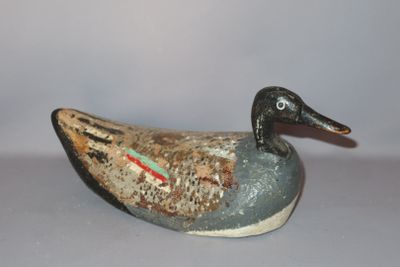 a small duck that is sitting on a table
