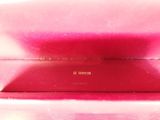 an image of a close up of a pink purse with a name on it