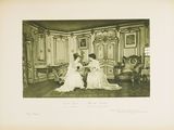 an old photo of two women in formal dress sitting in a room
