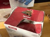 boxes of vacuum cleaners on a wooden table with a box on the table