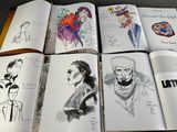 a lot of drawings on the pages of a book