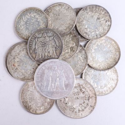an image of a bunch of silver coins on a white surface