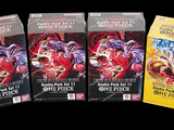 three packs of card games sitting on top of a black table