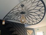 une photo d'un escalier en colimaçon dans une maison