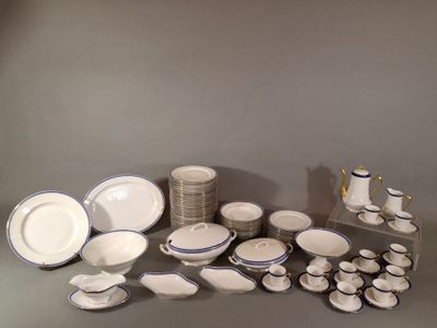 a lot of white and blue dishes and cups on the table