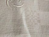 a close up of a piece of cloth with a cat on it