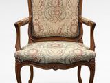 an image of a chair with a floral upholstered seat