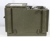 an old military box with a small electronic device inside of it