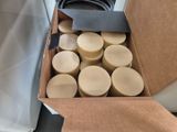 a cardboard box filled with waxs and a pair of scissors