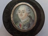 a picture of a miniature portrait of a man in a suit