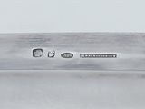 an image of a close up of a silver plate on a table