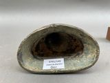 a close up of a vase with a tag on it