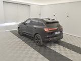 an image of a car in a garage with a checkered floor