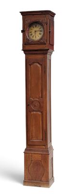 a tall wooden grandfather clock on display against a white background