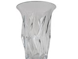 un vase en verre posé sur une surface blanche