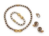 an assortment of jewelry including a necklace, bracelet, and ring